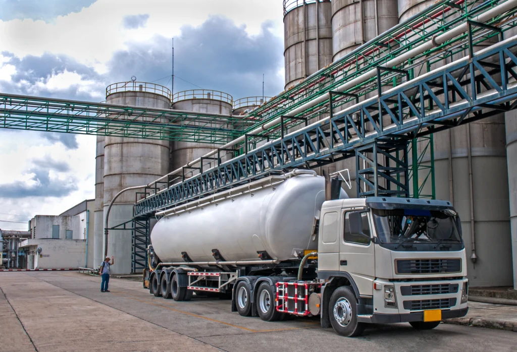 Bulk fuel tanker truck loading at refinery