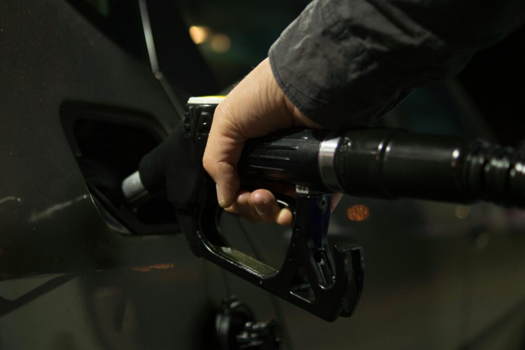 Person refueling a vehicle to illustrate the importance of maintaining diesel fuel quality.