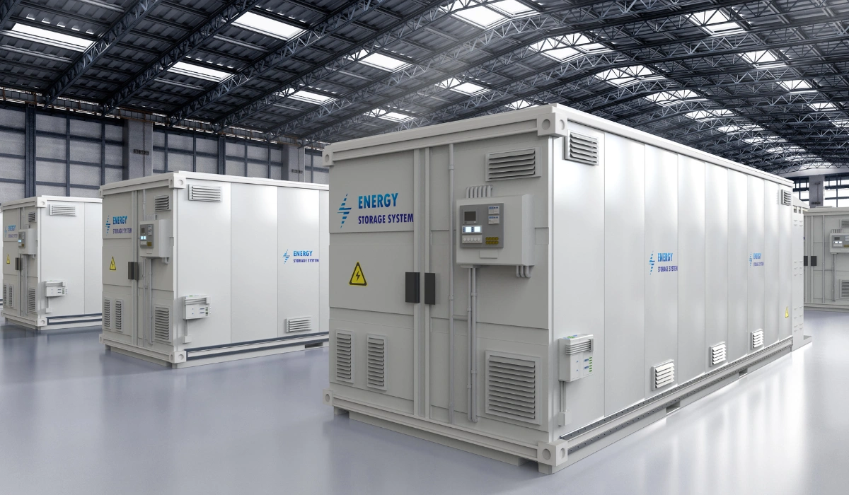Large industrial energy storage system containers inside a clean warehouse facility.